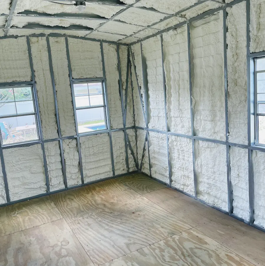 Closed-cell spray foam insulation applied to wall cavities in a residential project in Vinita